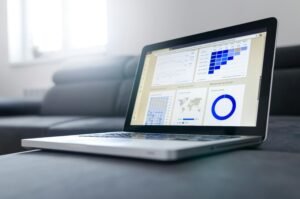 Laptop on a table with a page open on a dashboard